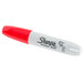 A close-up of a red and white Sharpie permanent marker.