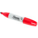 A red Sharpie permanent marker with a white cap.
