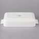 A white rectangular porcelain baking dish with a lid.