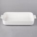 A white rectangular Villeroy & Boch baking dish with handles.