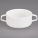 A white porcelain bowl with two handles.