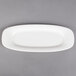 A Villeroy & Boch white porcelain oval platter on a gray surface.