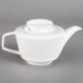 A white Villeroy & Boch teapot with a handle.