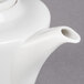 A white Villeroy & Boch porcelain coffeepot with a lid and spout.