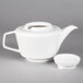A white Villeroy & Boch porcelain teapot with a cover.