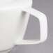 A close-up of a white Villeroy & Boch porcelain teapot.
