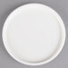 A white porcelain serving dish with a round rim.