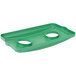 A green rectangular plastic lid with two holes.