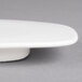 A close-up of a Villeroy & Boch white porcelain oval plate.