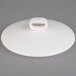 A white porcelain serving dish lid with a knob.