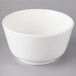 A Villeroy & Boch white porcelain bowl with a small rim on a gray surface.