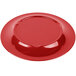 A red Carlisle melamine plate with a wide circular rim.