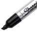 A close-up of a black Sharpie King Size permanent marker with a chisel tip.