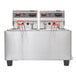A Cecilware stainless steel electric countertop deep fryer with two red handles.