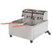 A Cecilware stainless steel electric countertop deep fryer with two fry tanks and orange handles.