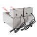 A Cecilware stainless steel electric countertop deep fryer with two fry tanks and attached cords.