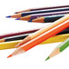 A group of Prismacolor colored pencils with different colors on a white background.
