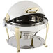 A silver and gold Bon Chef chafer with a roll top lid.