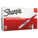 A box of red Sharpie fine point retractable permanent markers with white labels.