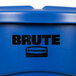 A close up of a blue Rubbermaid BRUTE trash can with the word "brute" on it.