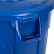A blue Rubbermaid BRUTE trash can with a lid.
