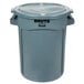 A gray Rubbermaid BRUTE plastic trash can with a lid.