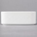 A white rectangular porcelain sugar packet holder with a diamond pattern on the lid.