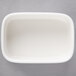 A white rectangular Villeroy & Boch porcelain sugar packet holder.