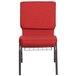 A red Flash Furniture church chair with metal legs.