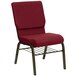 A Flash Furniture burgundy church chair with metal legs.