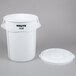 A white Rubbermaid BRUTE 55 gallon round trash can with a lid.