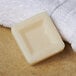 A white square PAYA facial soap on a white surface.