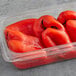 A plastic container of Regal roasted red bell peppers.