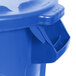 A blue Rubbermaid BRUTE recycling can with a lid.