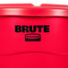 A red Rubbermaid Brute trash can with a lid.