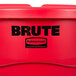 A red Rubbermaid BRUTE trash can and lid.