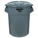 A grey Rubbermaid BRUTE trash can with lid.