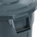A close up of a gray Rubbermaid BRUTE 55 gallon trash can with a lid.