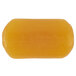 A close up of a yellow PAYA Orange and Papaya bar soap with black text on it.