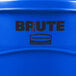 A close up of a blue Rubbermaid BRUTE trash can lid with a black logo.