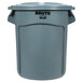 A Rubbermaid BRUTE 20 gallon gray plastic trash can with lid.