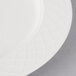 A close-up of a white Villeroy & Boch Bella porcelain platter with a circular design.