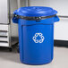 A blue Rubbermaid recycling can with a recycling symbol on it.