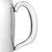 A Vollrath stainless steel water pitcher with a handle.