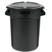 A black Rubbermaid BRUTE round trash can with a lid.