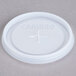 A translucent Cambro disposable lid with a cross on top.