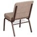 A Flash Furniture beige church chair with a metal frame and book rack.