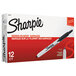 A box of 12 Sharpie fine point retractable permanent markers with black and red text on the box.