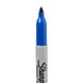 A blue Sharpie permanent marker with a white cap.