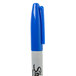 The white tip of a blue Sharpie permanent marker.